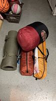 Group view of sleeping mat, sleeping bag, and both packed tents