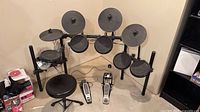 Full view of electronic drum kit, pedals and stool