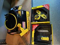 Craftsman extension cord reel, Stanley stud finder, level, utility knife
