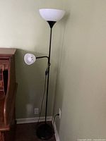 Full view of floor lamp beside desk, shows overall design