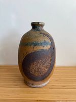 front view showing abstract motif and glaze