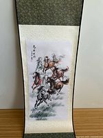 Full view of hanging scroll with brocade borders and central horse painting