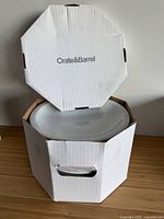 Box open showing top plate and Crate & Barrel branding