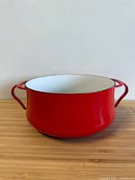 Side view showing red exterior and handles