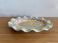 Top angle of entire platter showing pattern and ruffled edge