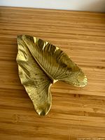 Top view of leaf-shaped metal trinket dish