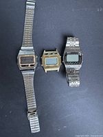Three digital watches side by side