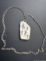 Full view of sterling chain necklace with pendant attached