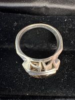 side view of sterling ring showing openwork gallery and hallmark area