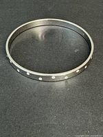 Full view of black bangle with crystals