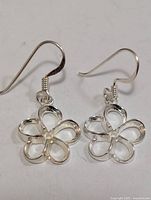 Front view of both silver flower earrings
