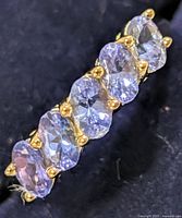 Close view of tanzanite stones and prongs