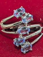 Front view showing five tanzanite stones and split shank