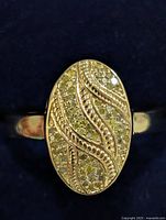 Front view of ring showing diamond oval face