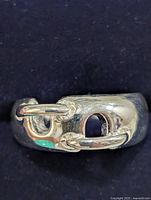 front view showing chain-link design on silver band