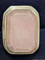 Front view showing rectangular rose quartz in silver bezel setting