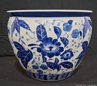 Front view of blue and white porcelain planter showing floral design