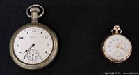 Front view showing both pocket watch dials
