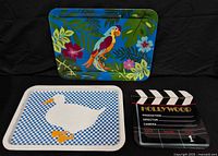 All three decorative metal serving trays displayed together