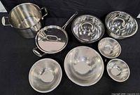 Overall view of stock pot, sauté pan with lid, and six mixing bowls