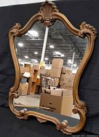 front view of ornate wood mirror