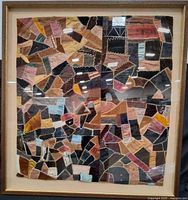 Front view of framed patchwork quilt artwork
