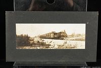 Front of mounted photograph showing steam locomotive passenger train