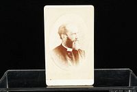 Front view of carte de visite showing sepia portrait of Principal Grant