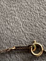 close-up of clasp and 10K hallmark tag on gold chain