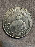 Obverse of coin showing George Bell and text