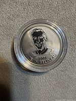 Obverse of coin showing Jean Béliveau portrait and year