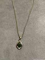 Full view of necklace on surface