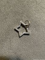 Front view showing pavé stones on star outline and loop