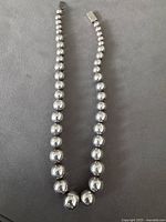 Full view of graduated sterling bead necklace