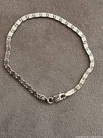 Full view of sterling silver bracelet laid flat