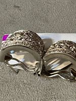 front view of both earrings showing filigree design and stones