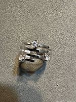 Ring showing overall wrap design and three stones