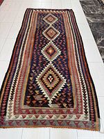Full view of entire Kilim rug showing pattern and size