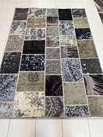 Full top view showing entire patchwork rug and color palette