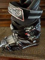 Side view showing buckle layout, branding, and shell condition