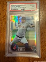 Front view of PSA-slabbed 2016 Bowman Draft Shane Bieber refractor card showing grade label