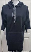 Full front view of black DKNY hoodie dress on mannequin