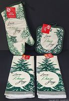 Full set showing oven mitt, pot holder, two towels