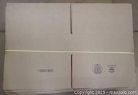 Stack of flat Uline corrugated boxes banded together