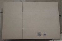 Stack of flat Uline corrugated boxes showing seams