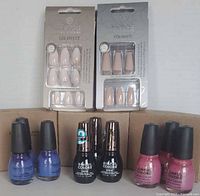 Lot overview showing Helios nail sets and three groups of Sinful Colors bottles