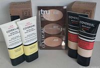 Front view of entire lot showing two primers, two foundations, contour palette