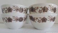 Four matching bowls showing exterior floral pattern