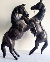 Both leather horse sculptures full view standing on hind legs