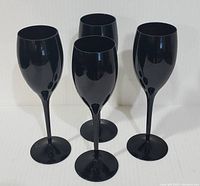 Front view of four black amethyst goblets